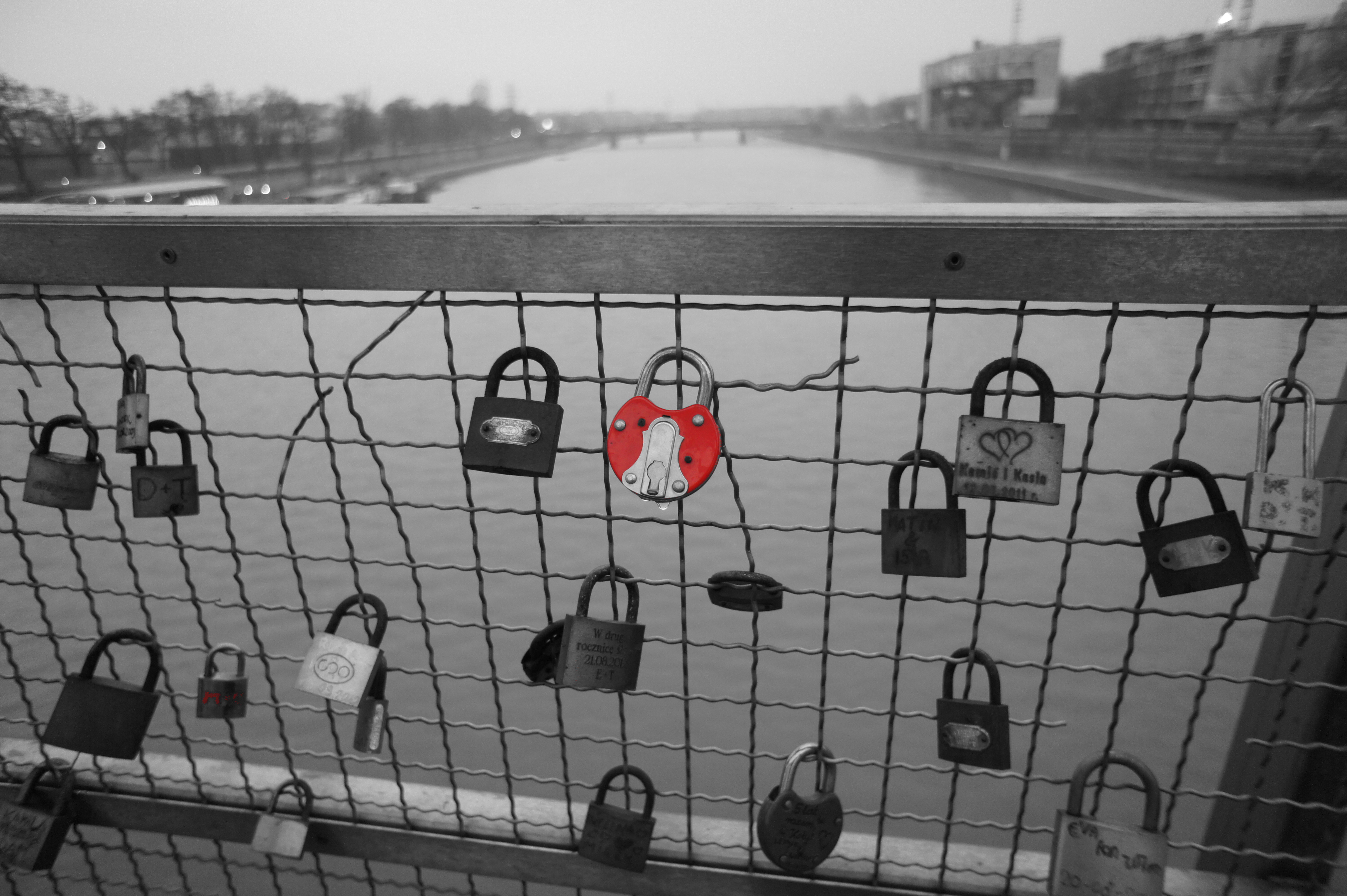 Padlocks with name of sweethearts and keys on the riverbed