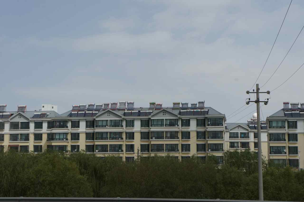 Modern buildings with solar thermal collectors on the roofs